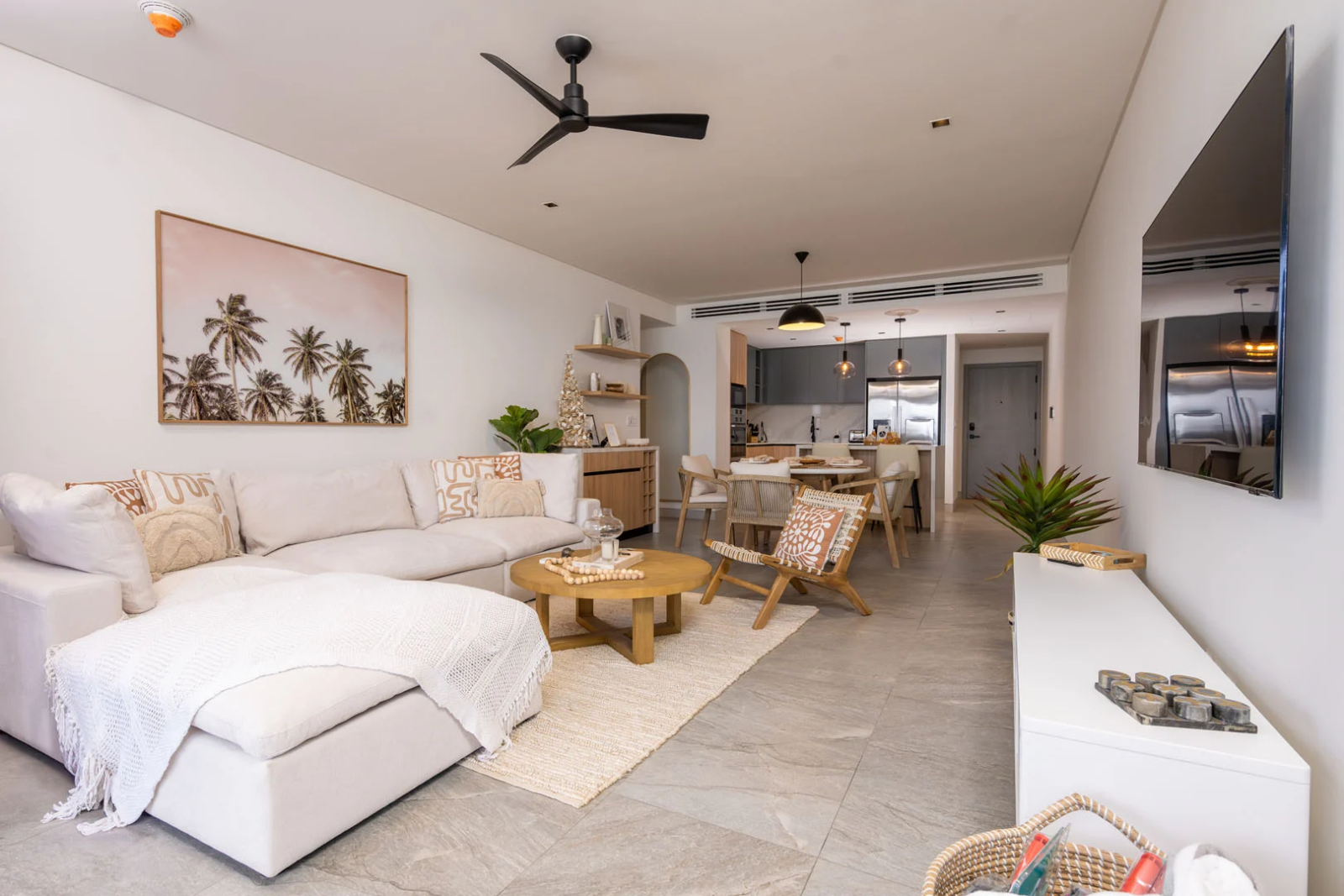 Open-concept living and dining area with stylish kitchen and contemporary island decor in Barbados vacation rental