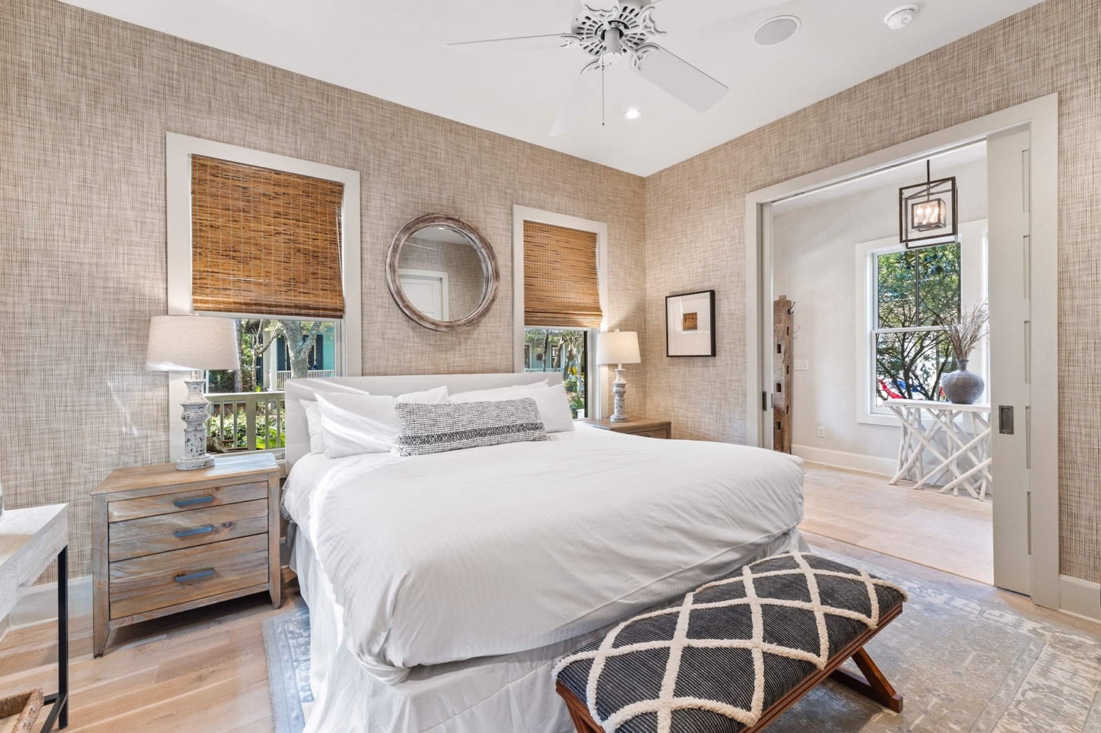 Cozy bedroom with king bed, neutral tones, and natural light in a Watercolor, Florida beach house