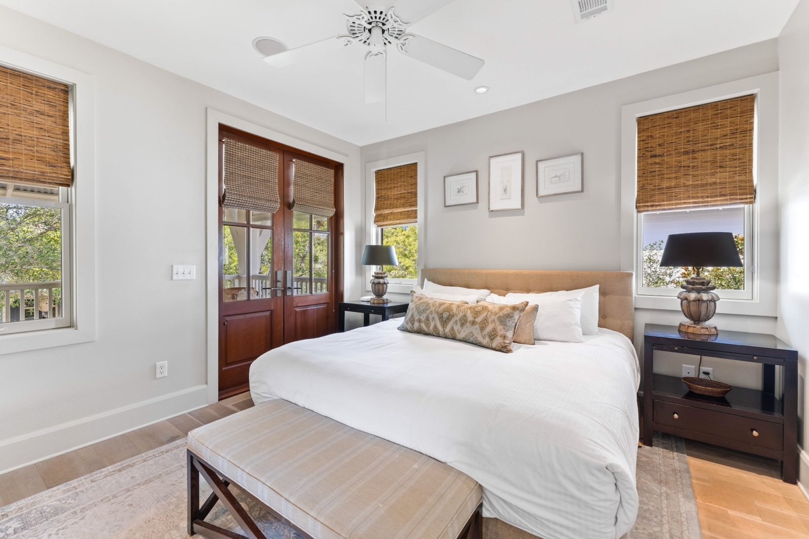 Charming bedroom with plush bedding and balcony access in upscale Watercolor, Florida vacation rental