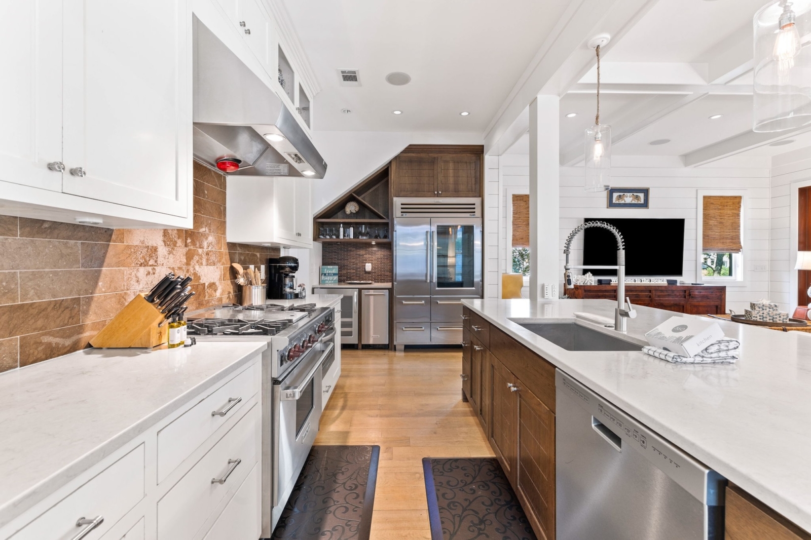 Gourmet kitchen with stainless steel appliances and large island in luxury Watercolor, Florida vacation home