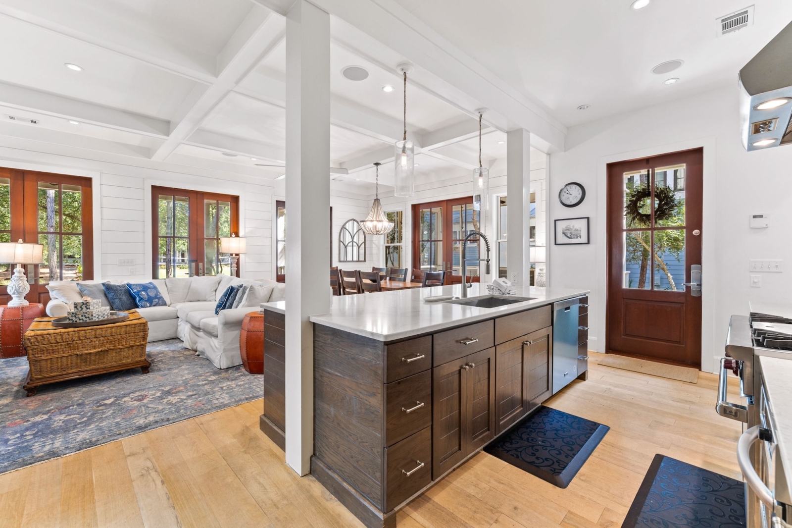 Open-concept kitchen and living area with elegant finishes in Watercolor, Florida coastal retreat