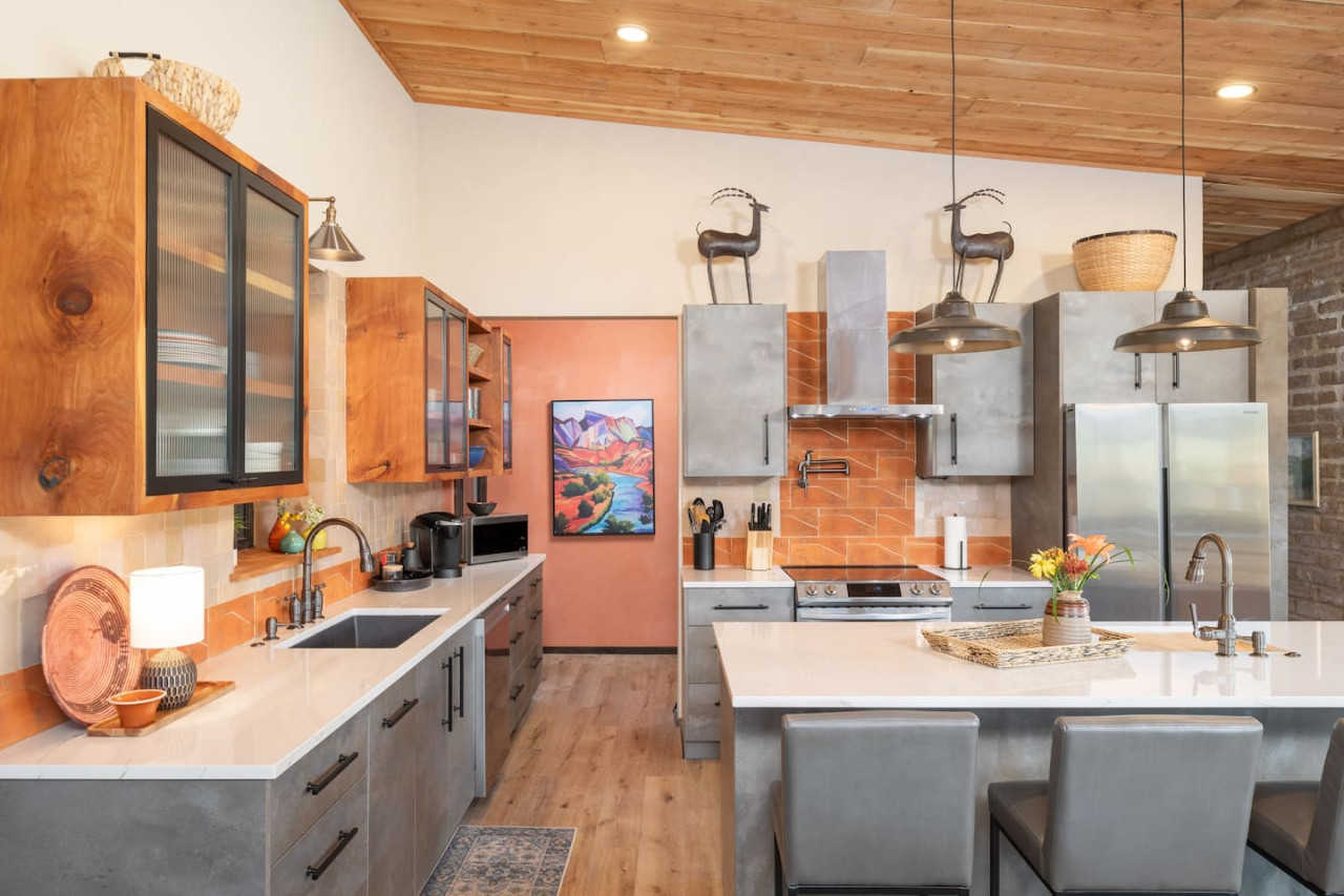 Modern Sedona kitchen with sleek appliances, rustic wood accents, and colorful decor.