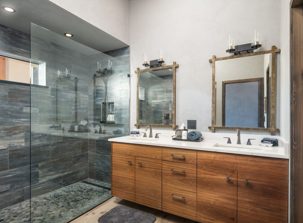 Spa-style bathroom with walk-in shower and modern vanity in Sedona getaway home.